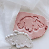 Female Ogre hand with engagement ring stamp and cutter