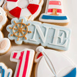 ONE with ship wheel “O” stamp and cutter