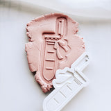 Test tube with bow stamp and cutter