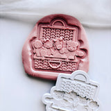 Stuffed toys in rattan basket Ralph Lauren stamp and cutter