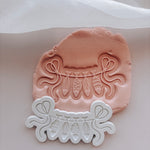 String line with hanging fish stamp and cutter