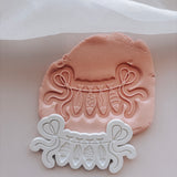 String line with hanging fish stamp and cutter