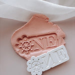 ONE with ship wheel “O” stamp and cutter
