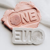ONE with wooden stump ’o’ stamp and cutter