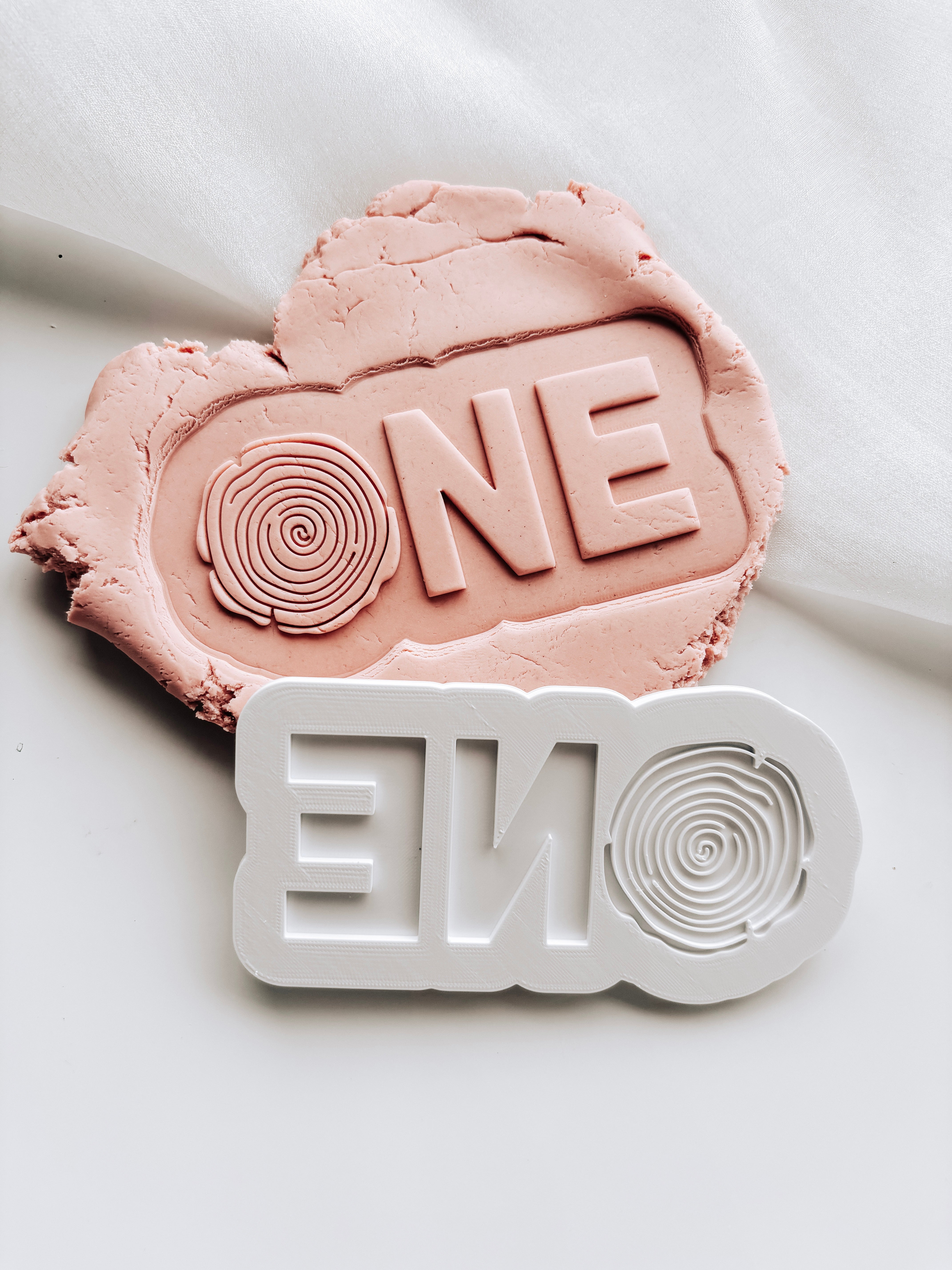 ONE with wooden stump ’o’ stamp and cutter