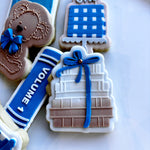 Stack of books with bow stamp and cutter