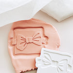 Bow tie on backer debosser and cutter