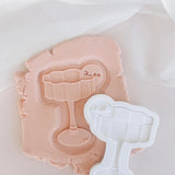 Wavy glass debosser and cutter with blank drink tag