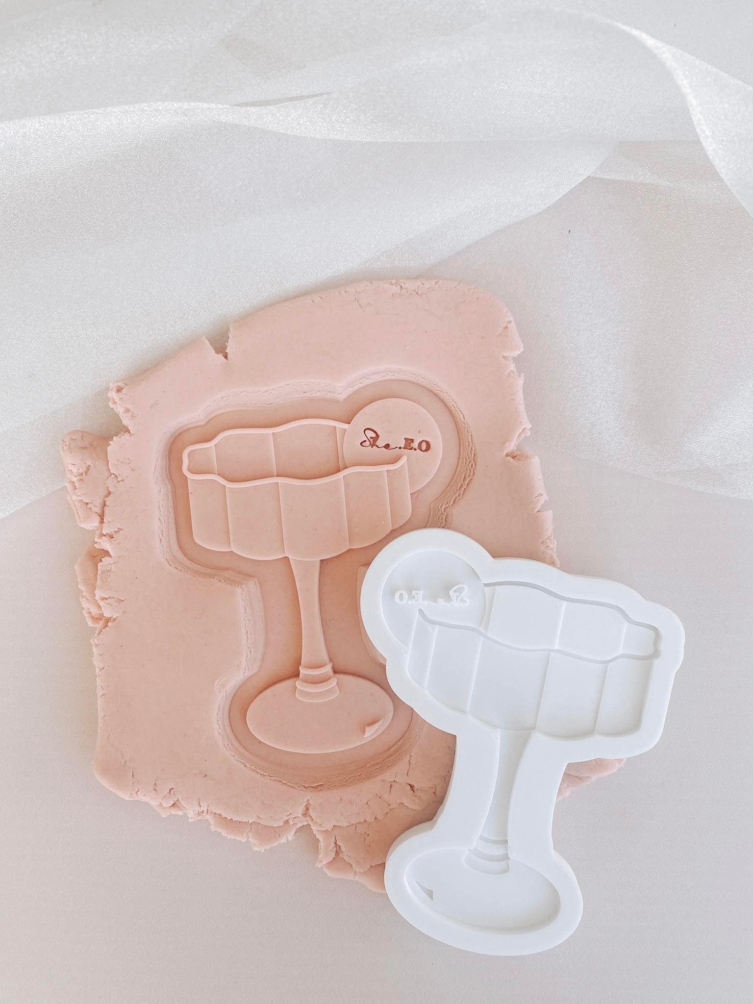 Wavy glass debosser and cutter with blank drink tag