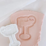 Wavy glass debosser and cutter with blank drink tag