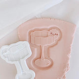 Wavy glass debosser and cutter with blank drink tag