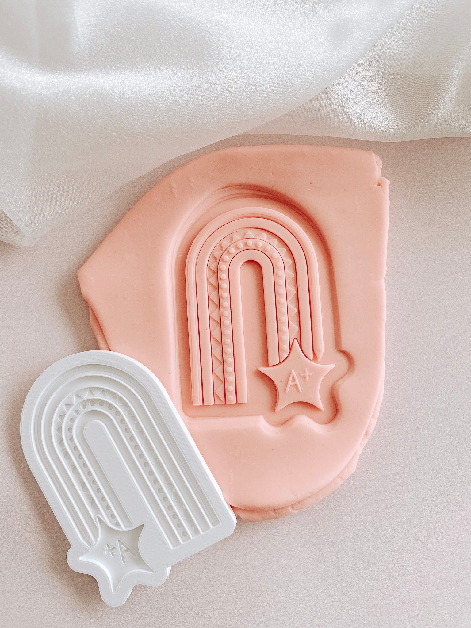 A + pencil rainbow arch debosser and cutter