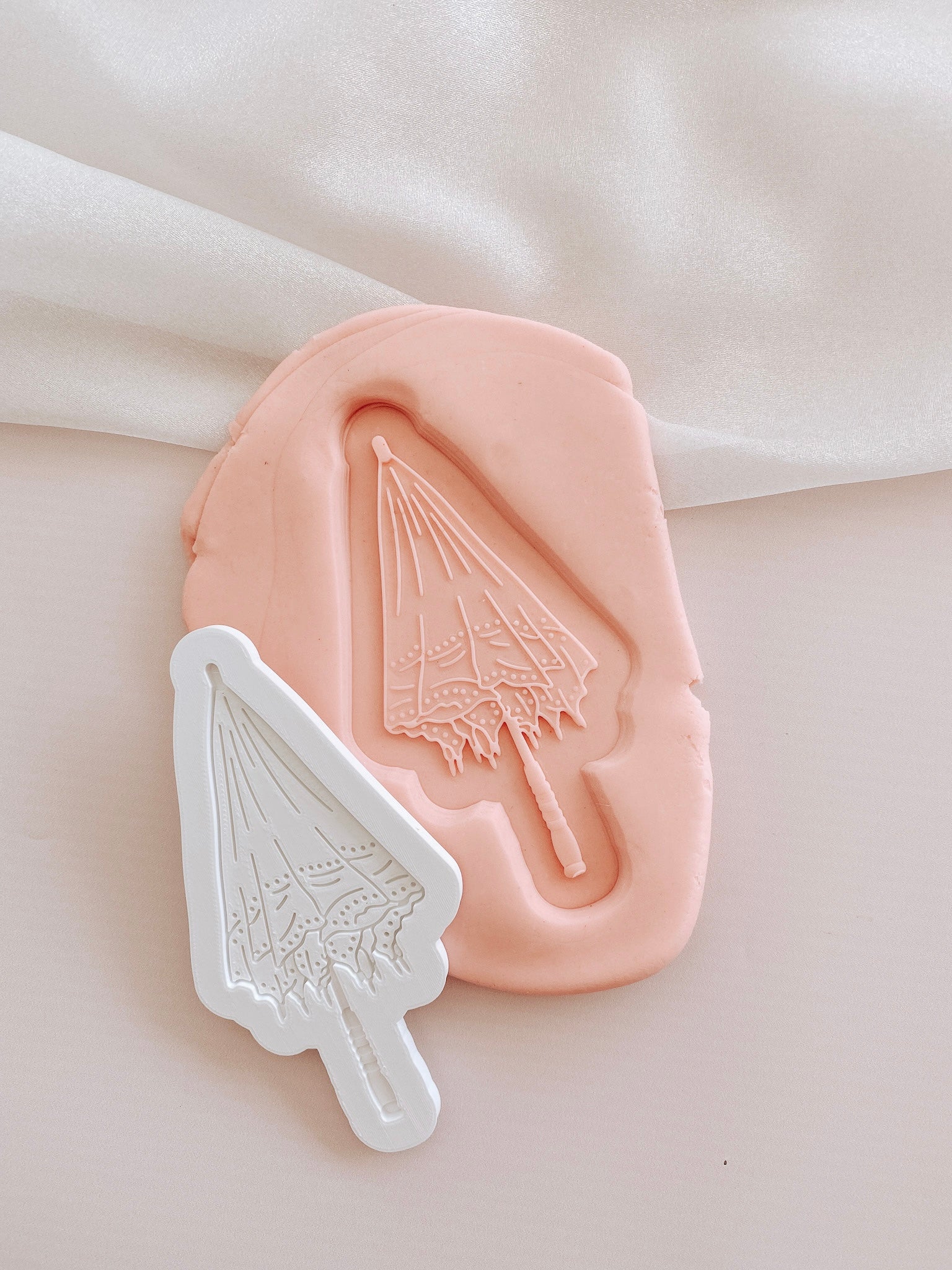 Parasol umbrella debosser and cutter