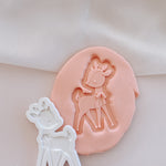 Standing deer with floppy bow