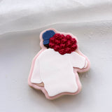 Man with bunch of roses on shoulder stamp and cutter