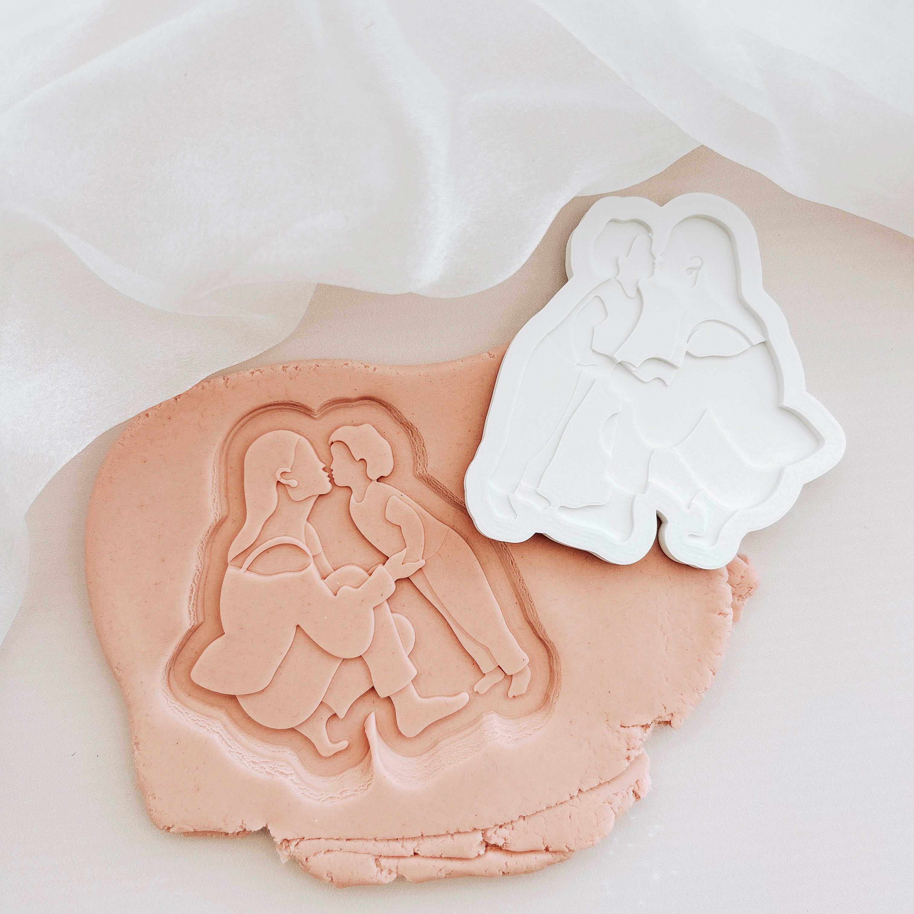 Mother’s Day silhouette- crouching and kissing child stamp and cutter