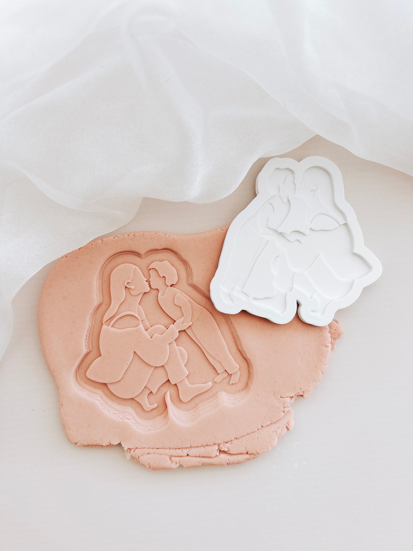 Mother’s Day silhouette- crouching and kissing child stamp and cutter