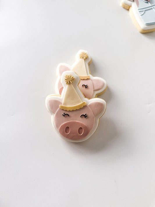 Pig head with party hat stamp and cutter