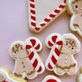 Gingerbread Girl Holding candy cane debosser stamp and cutter