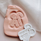 Gingerbread Boy Holding candy cane debosser stamp and cutter