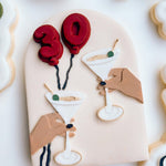 Martini’s cheers in arch stamp and cutter