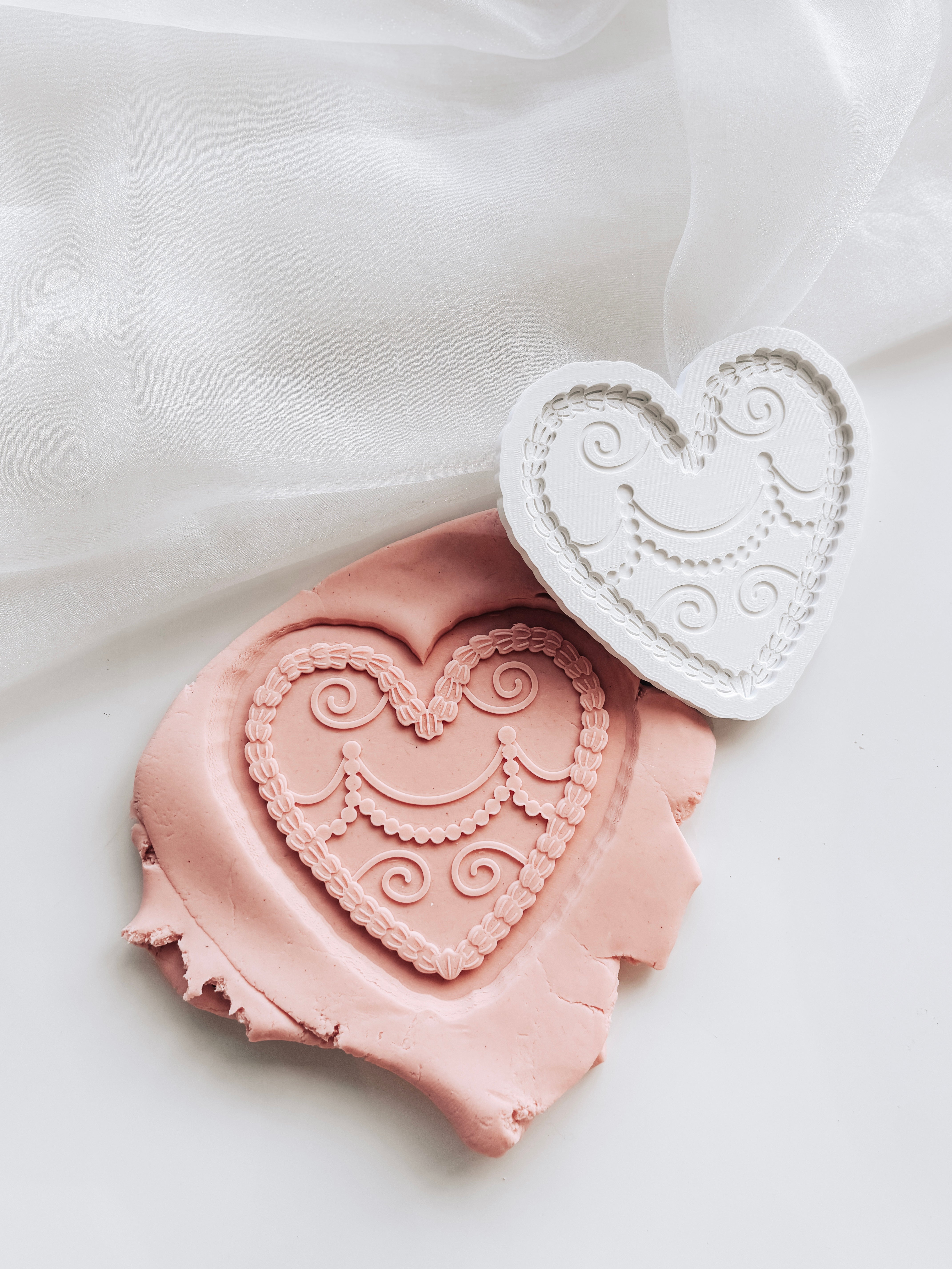 Piped cream heart shapes cake stamp and cutter