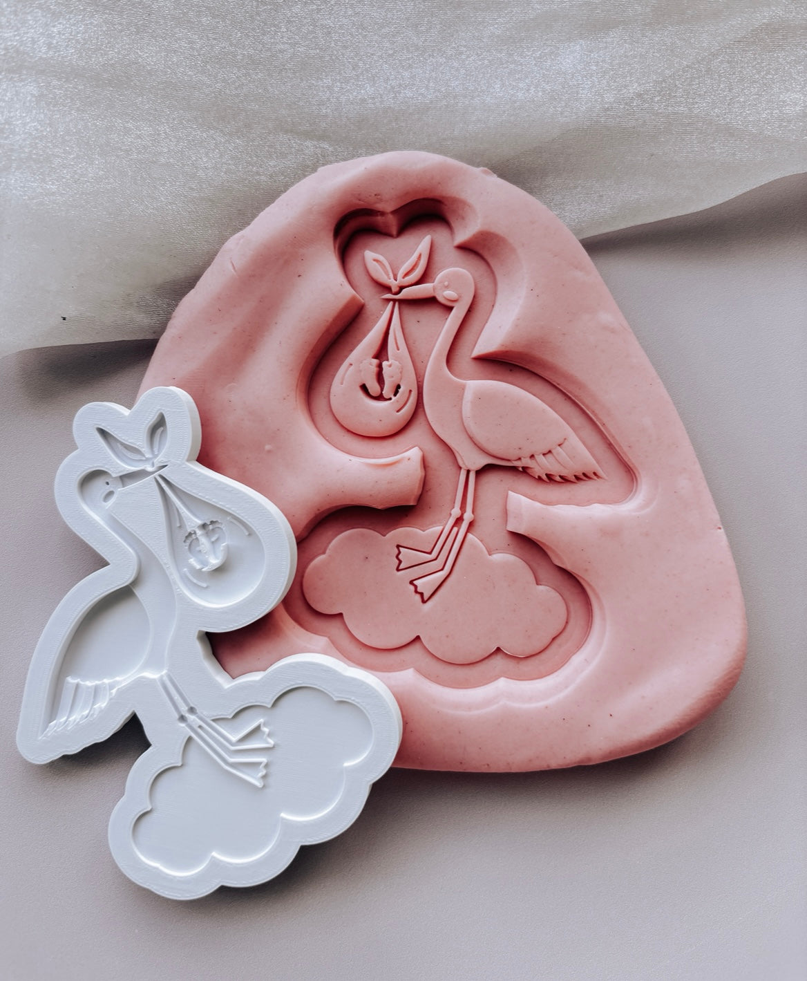 Stork standing on a cloud with baby in swaddle stamp and cutter