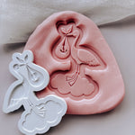 Stork standing on a cloud with baby in swaddle stamp and cutter