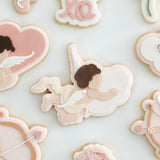 Cupid flying holding cloud stamp and cutter