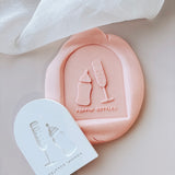 Popping bottles champagne and bay bottle in arch debosser and cutter