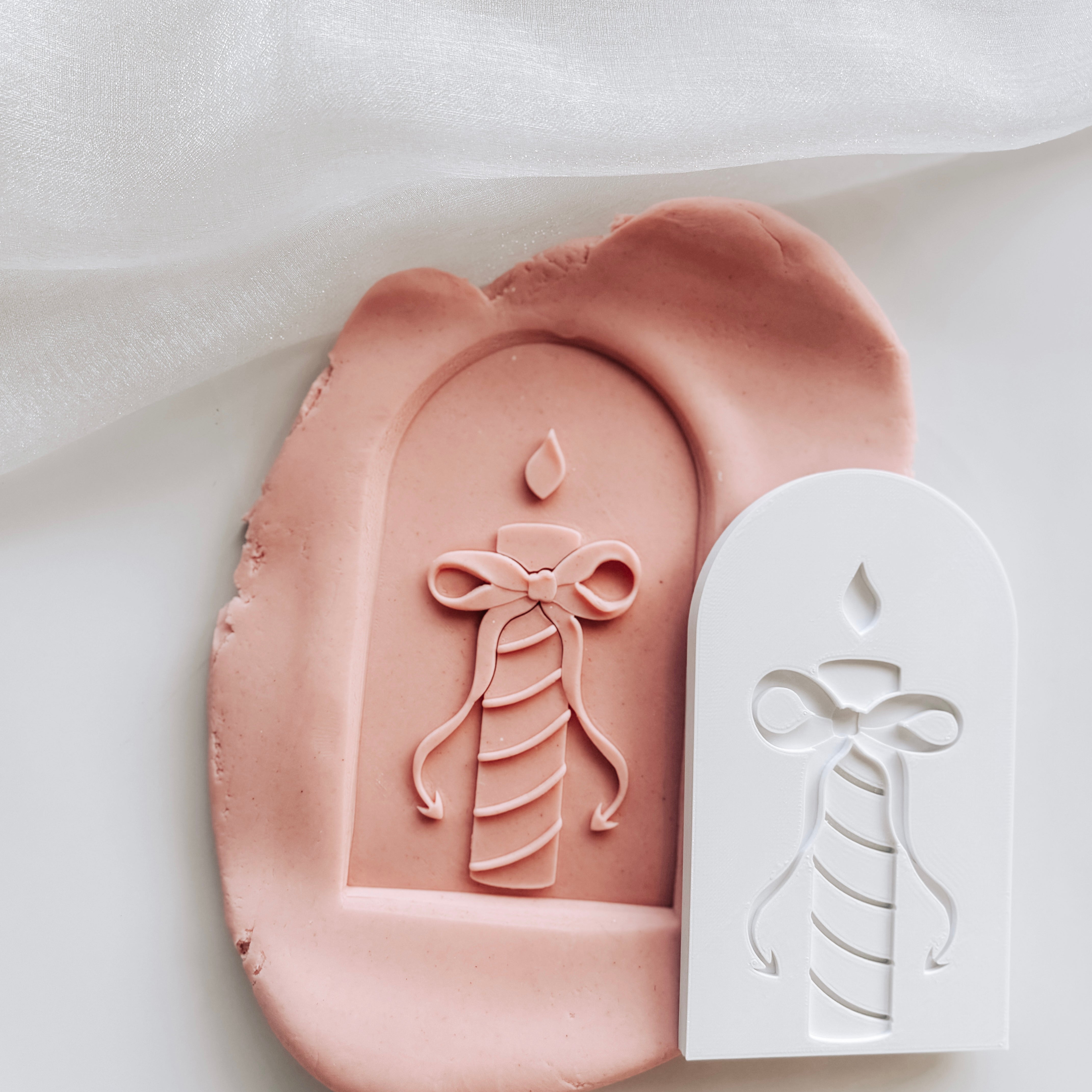 Stripes candle with devils tail bow in arch stamp and cutter