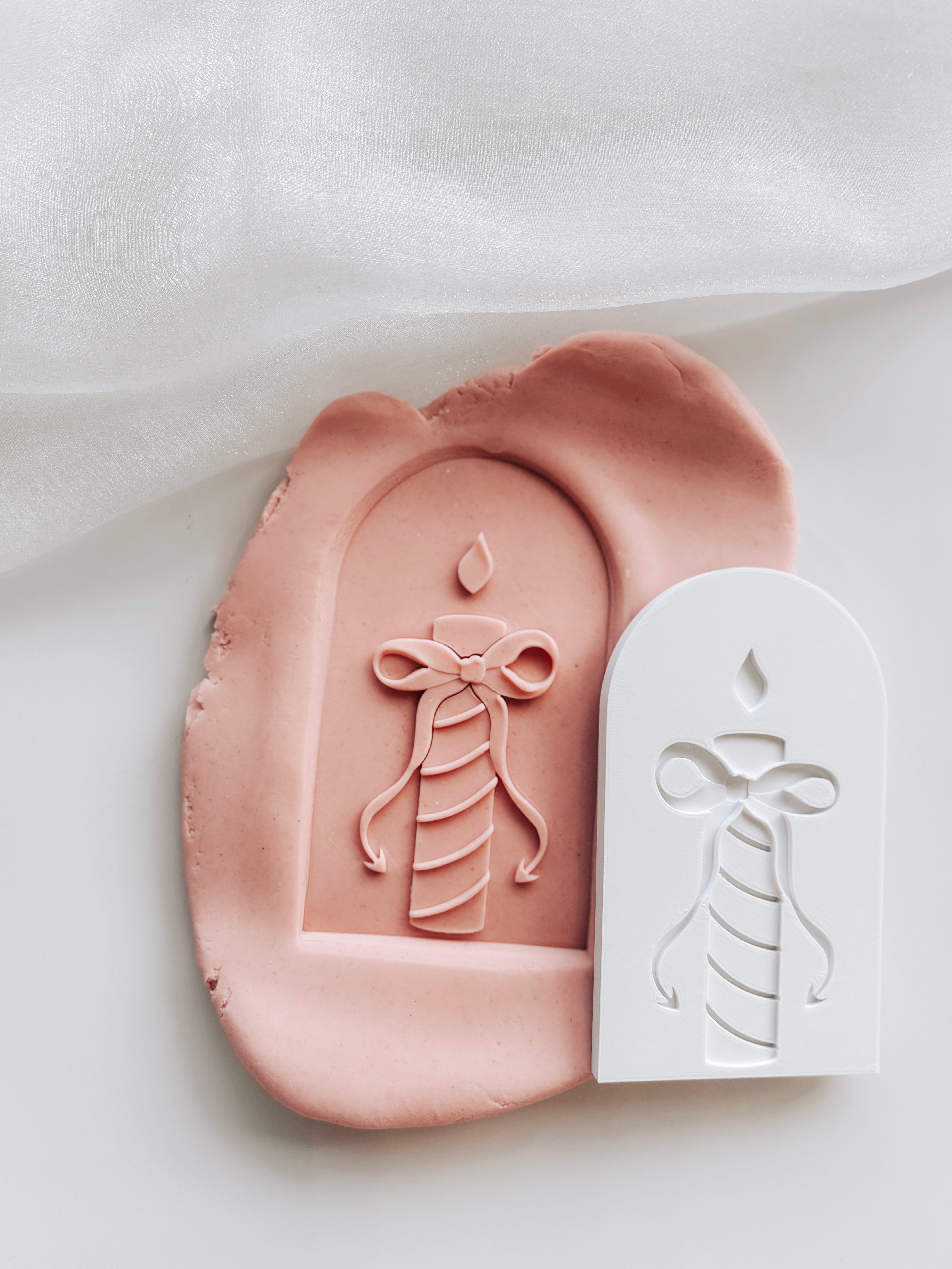 Stripes candle with devils tail bow in arch stamp and cutter