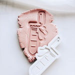 Test tube with bow stamp and cutter