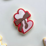 Heart shaped biscuit with bow stamp and cutter