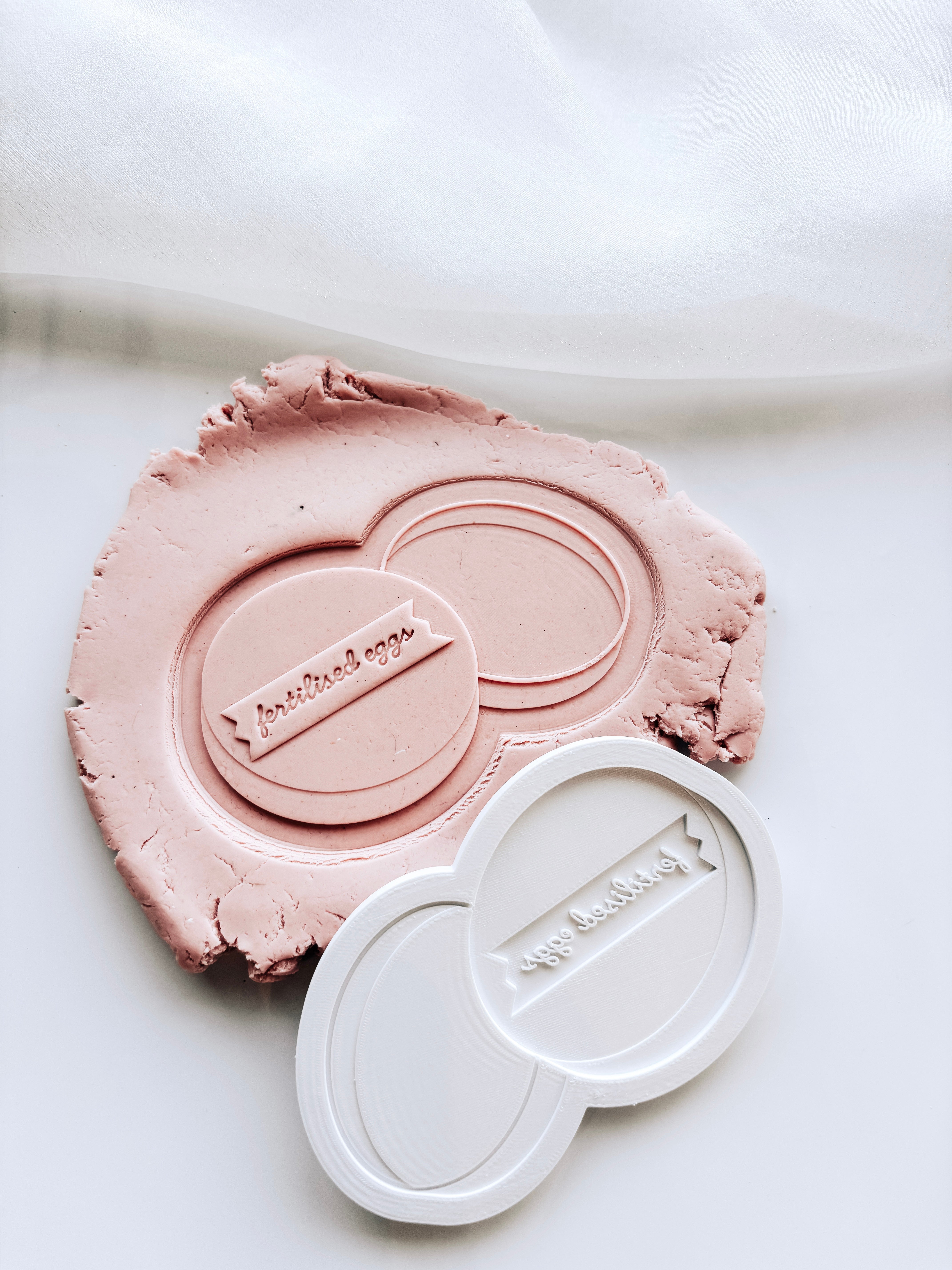 Petri Dish with “fertilised eggs” label stamp and cutter