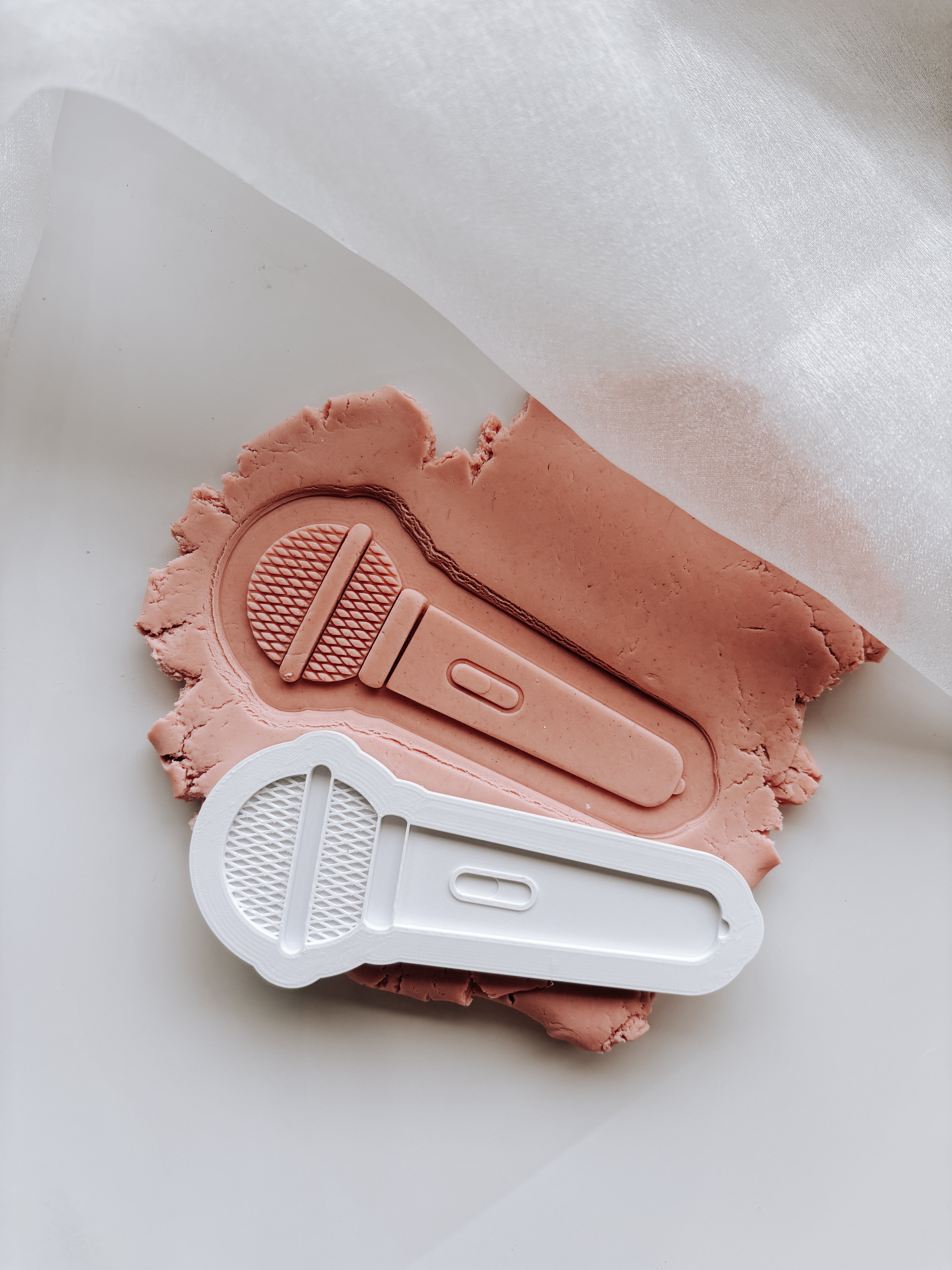 Microphone debosser and cutter