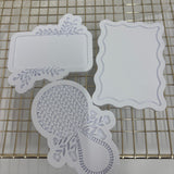Odd Bunch-greenery plaque, floral rattan rattle & wavy rectangle