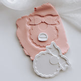 Sweet bib with scalloped edge stamp and cutter