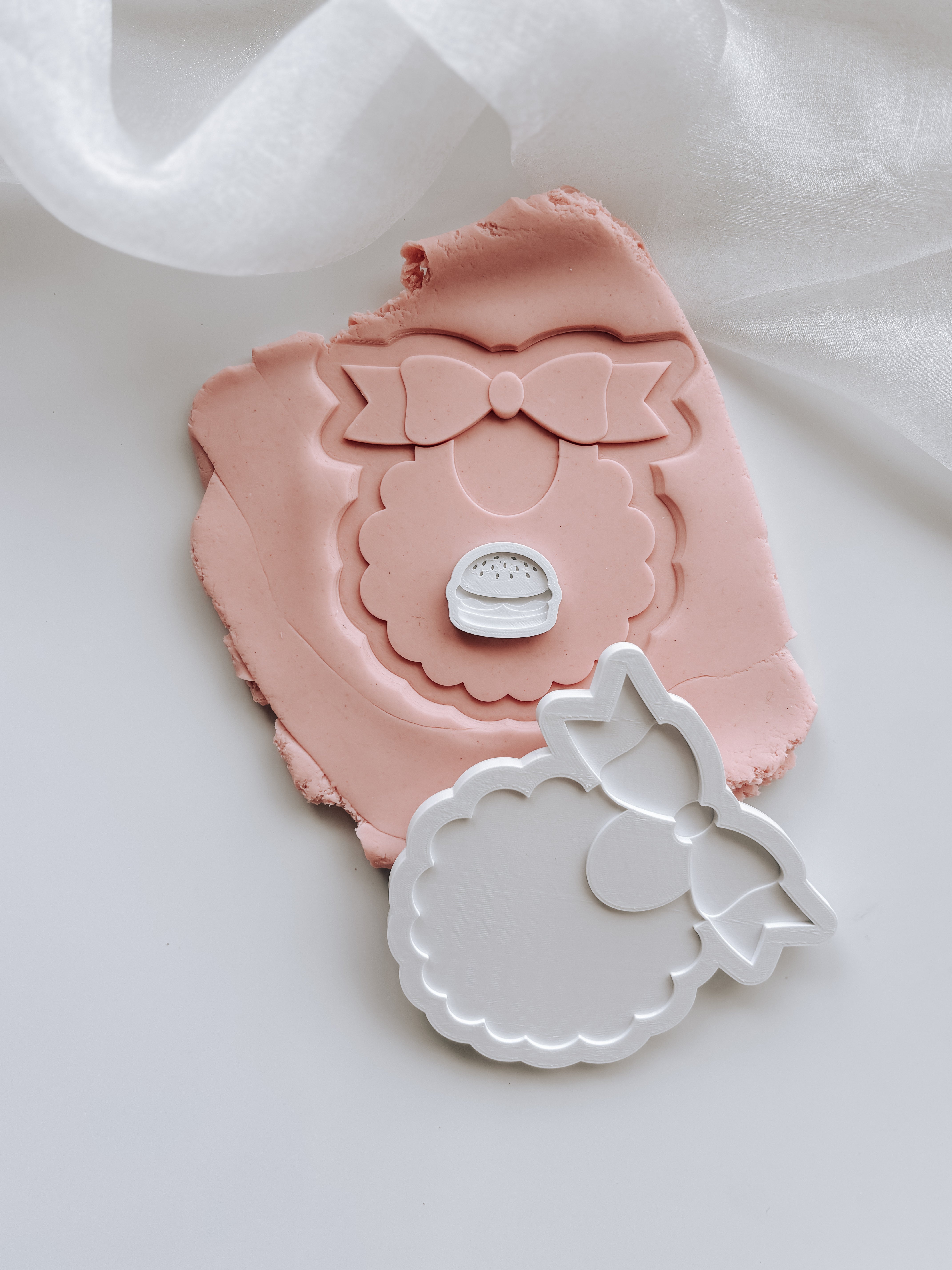 Sweet bib with scalloped edge stamp and cutter