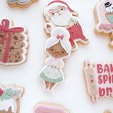 Mrs CLAUS in baking apron debooser and cutter