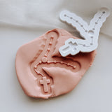 Rosary beads with shaped cutter