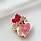 Heart shaped biscuit with bow stamp and cutter