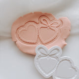 Love locket with bow stamp and cutter