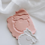 Sweet bib with scalloped edge stamp and cutter