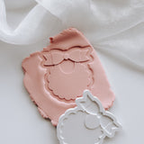 Sweet bib with scalloped edge stamp and cutter