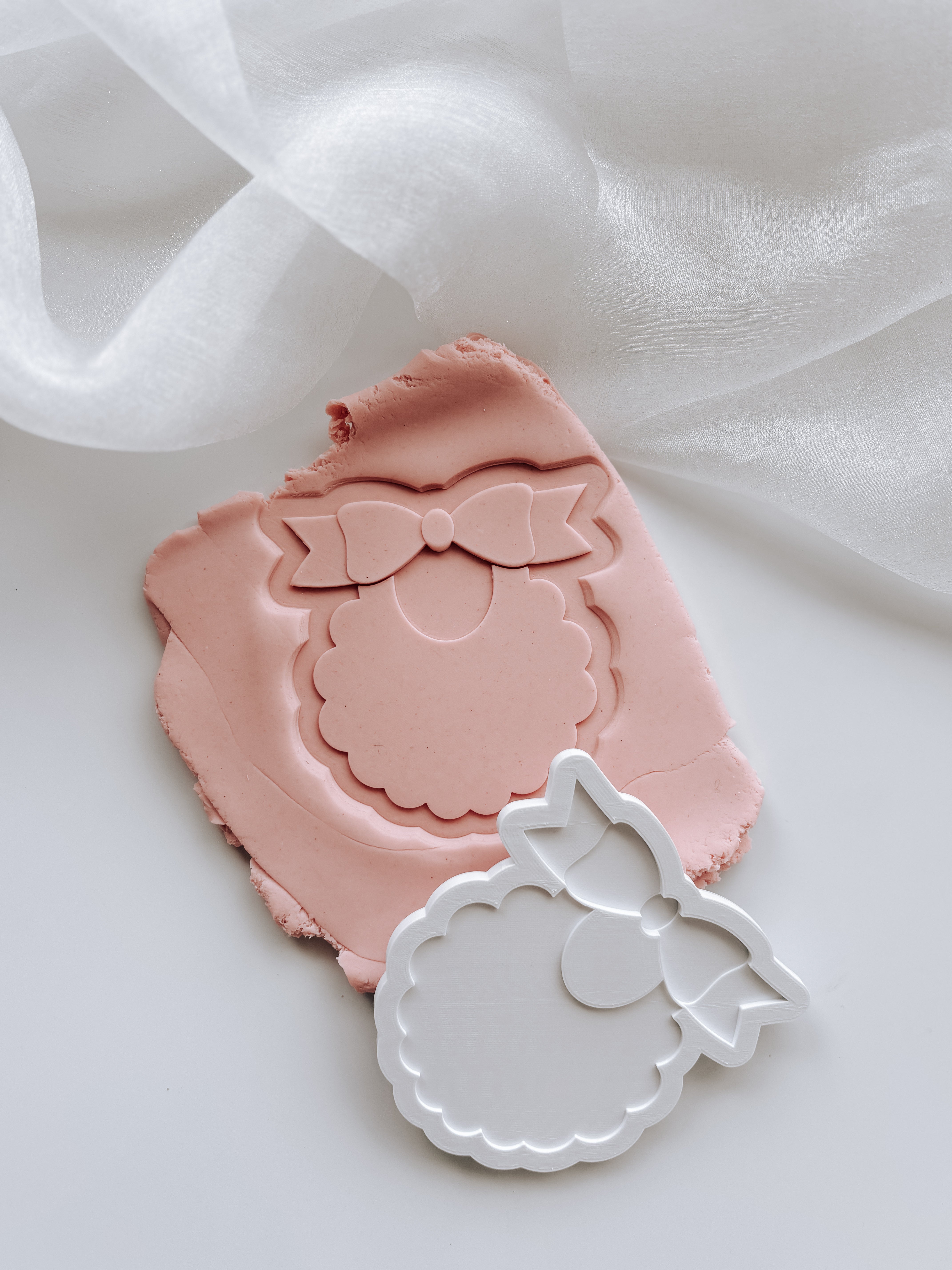 Sweet bib with scalloped edge stamp and cutter