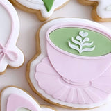 Short mug latte on scalloped edge plate Debosser & Cutter