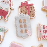 Tray of gingerbread men debosser and cutter