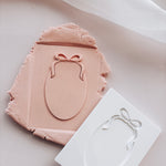 Oval with bow stamp and cutter