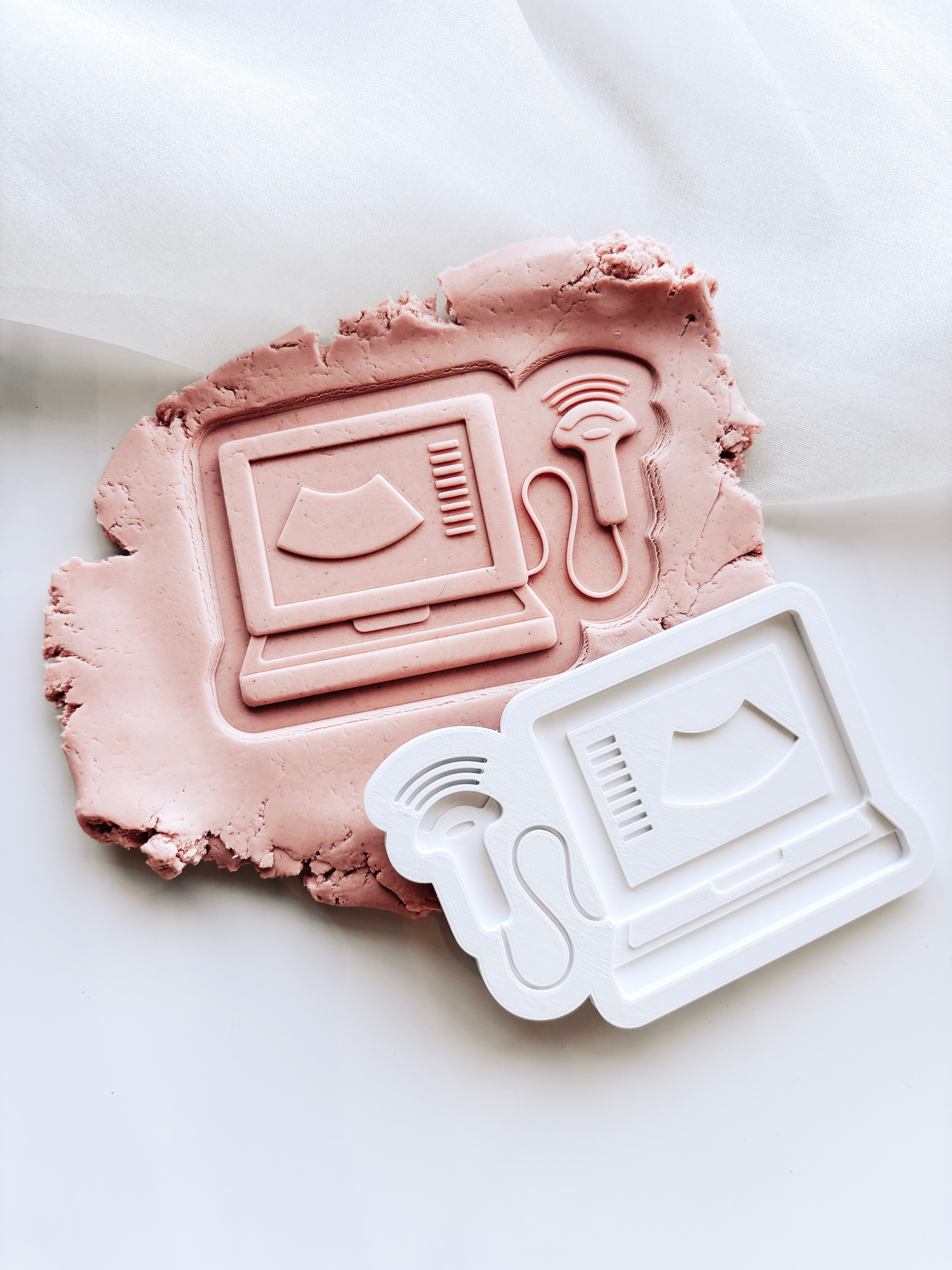 Ultrasound machine stamp and cutter